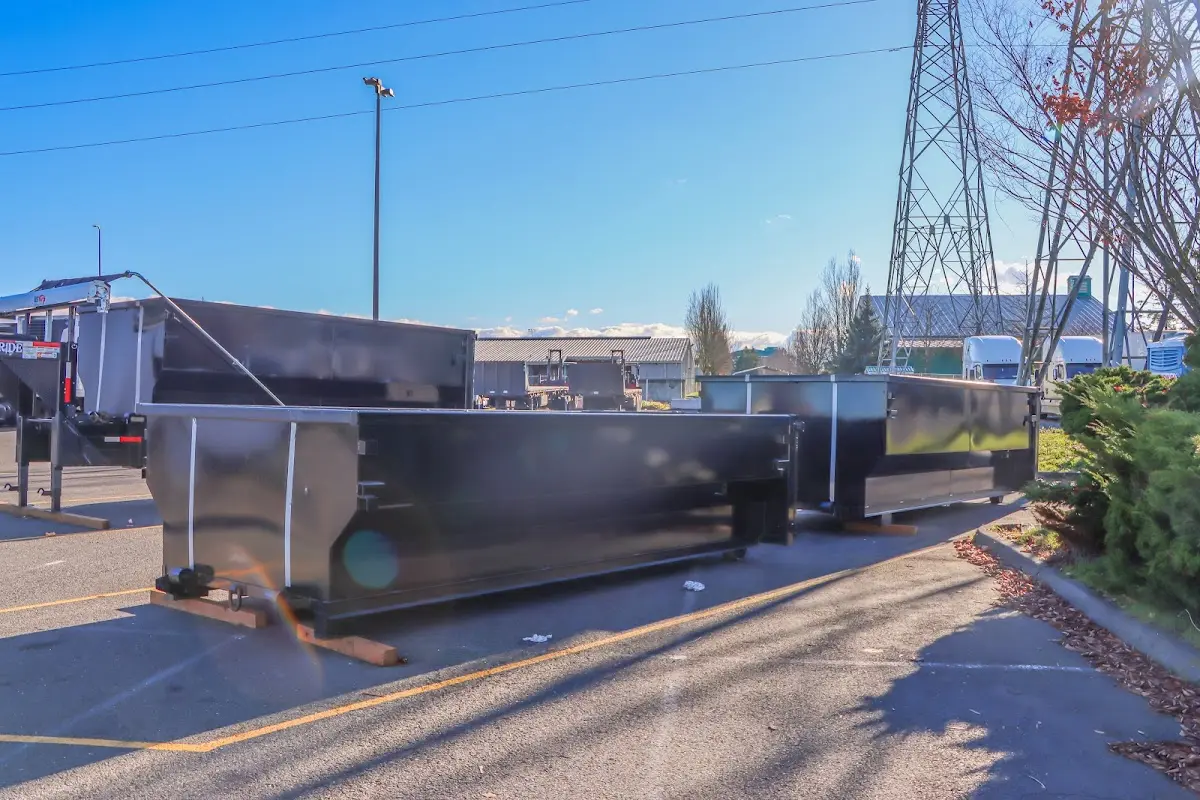 Roll-off dumpster ready for waste disposal at job site for Concrete Dumpster Rental in Plymouth
